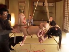Lovely Asian babe with big tits gets tied up and suspended