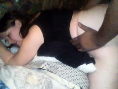 Curvy brunette has a black guy plowing her cunt doggystyle